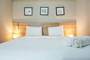 Elegant 1BR Apartment with Working Space Mustika Golf Residence By Travelio